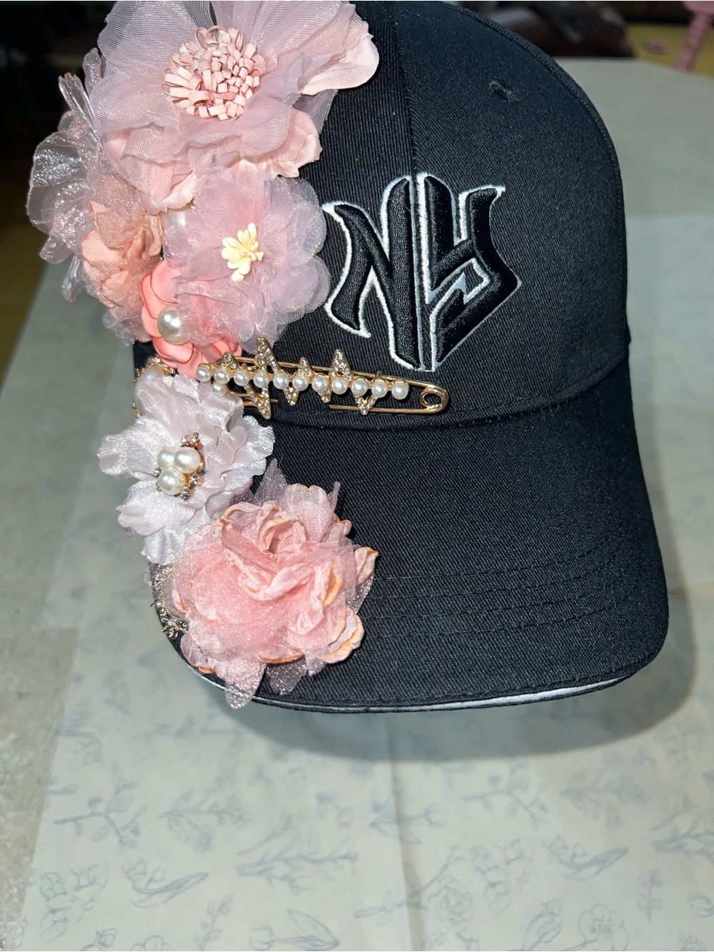 Embellished Black NY Baseball Cap with Pink Floral Accents